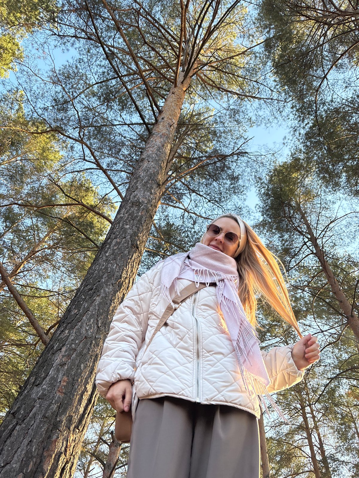 Woman spends afternoon at waterfront park in Chaikovsky, Russia