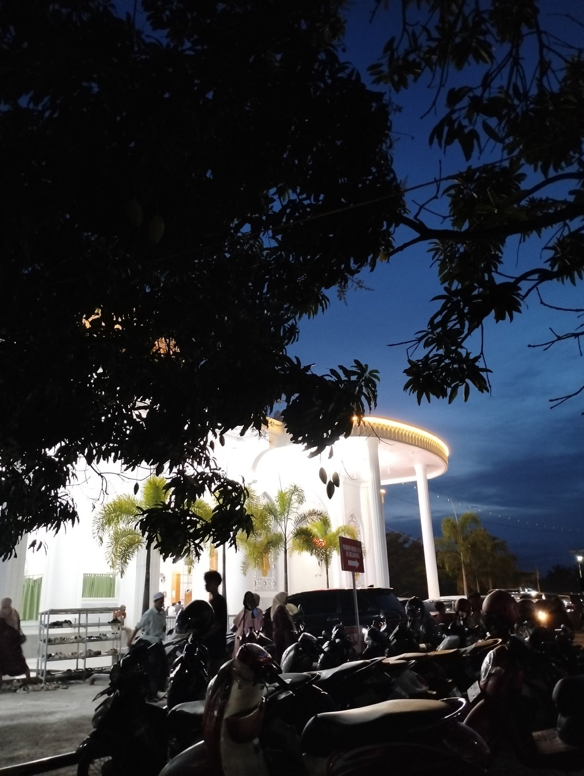 Illuminated white building with circular structure observed in Blangmetimu
