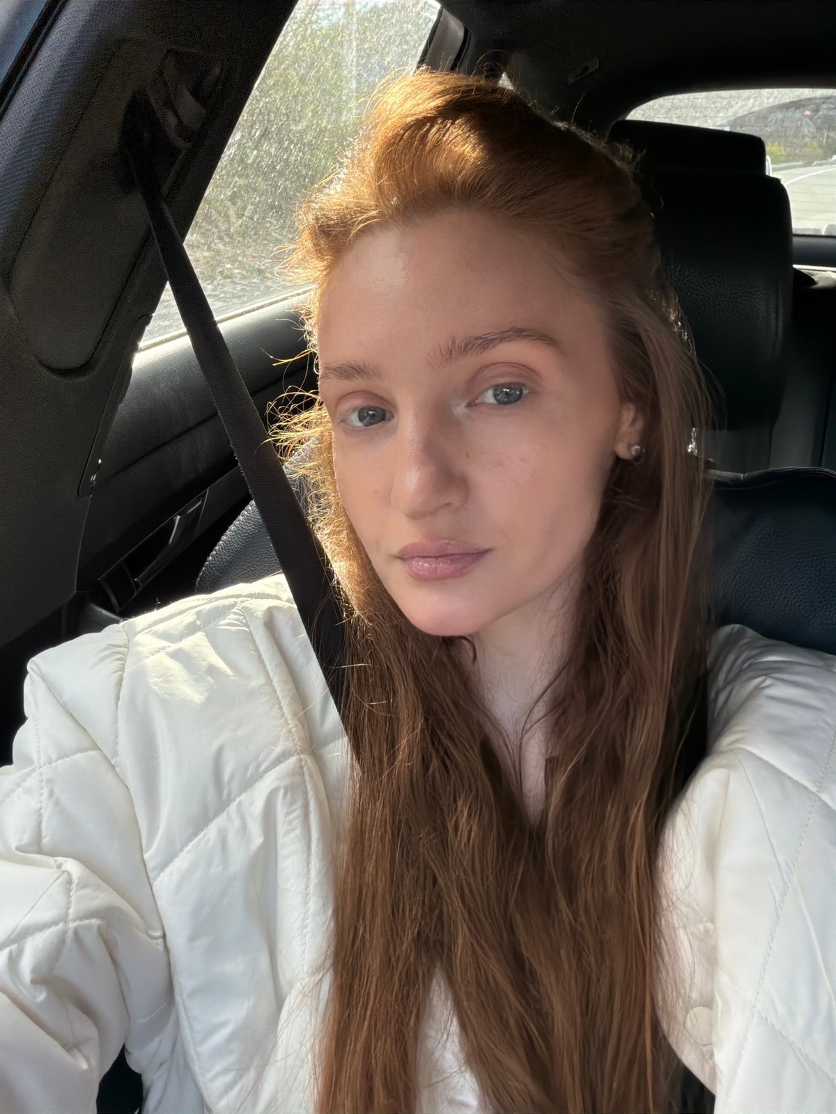 Woman in white jacket observed in vehicle, Montenegro