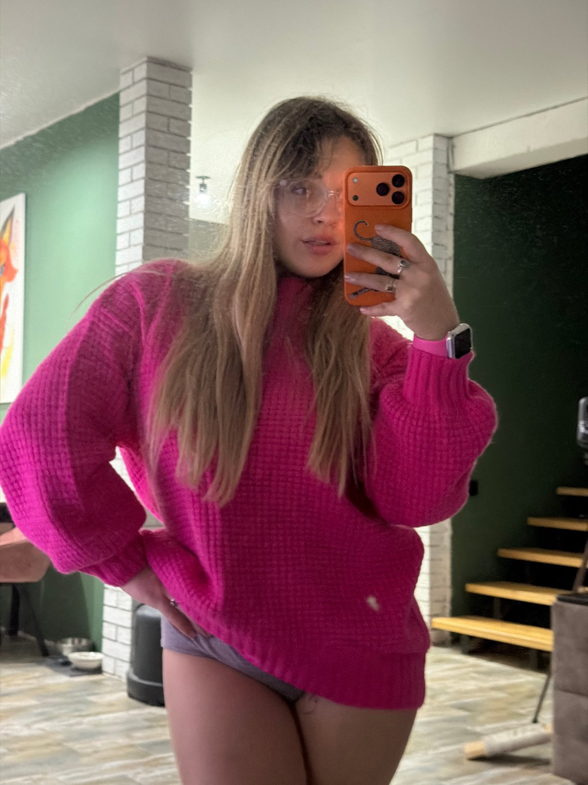 Woman takes mirror selfies in pink sweater, Russia