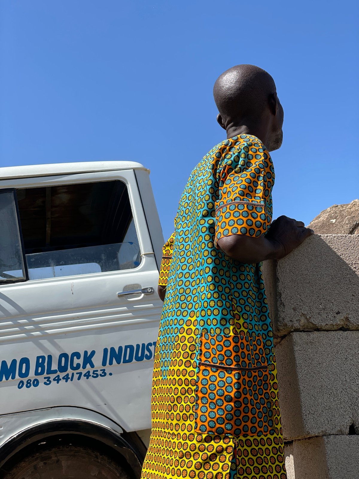 Concrete block delivery and a resting dog in Jos