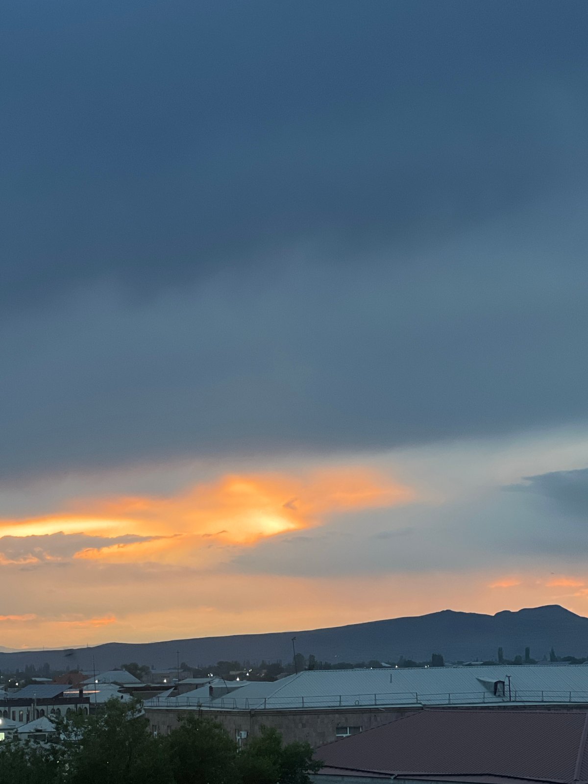 Sunset observed over Vagharshapat with mountain backdrop