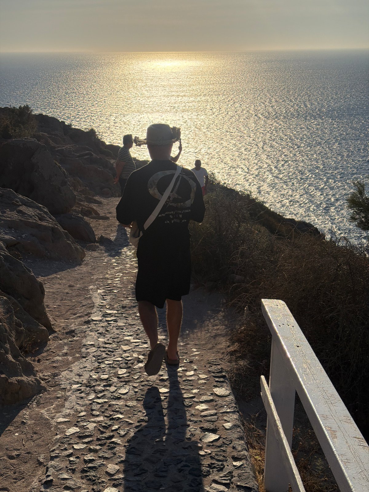 Clifftop lighthouse and coastal paths in Santorini