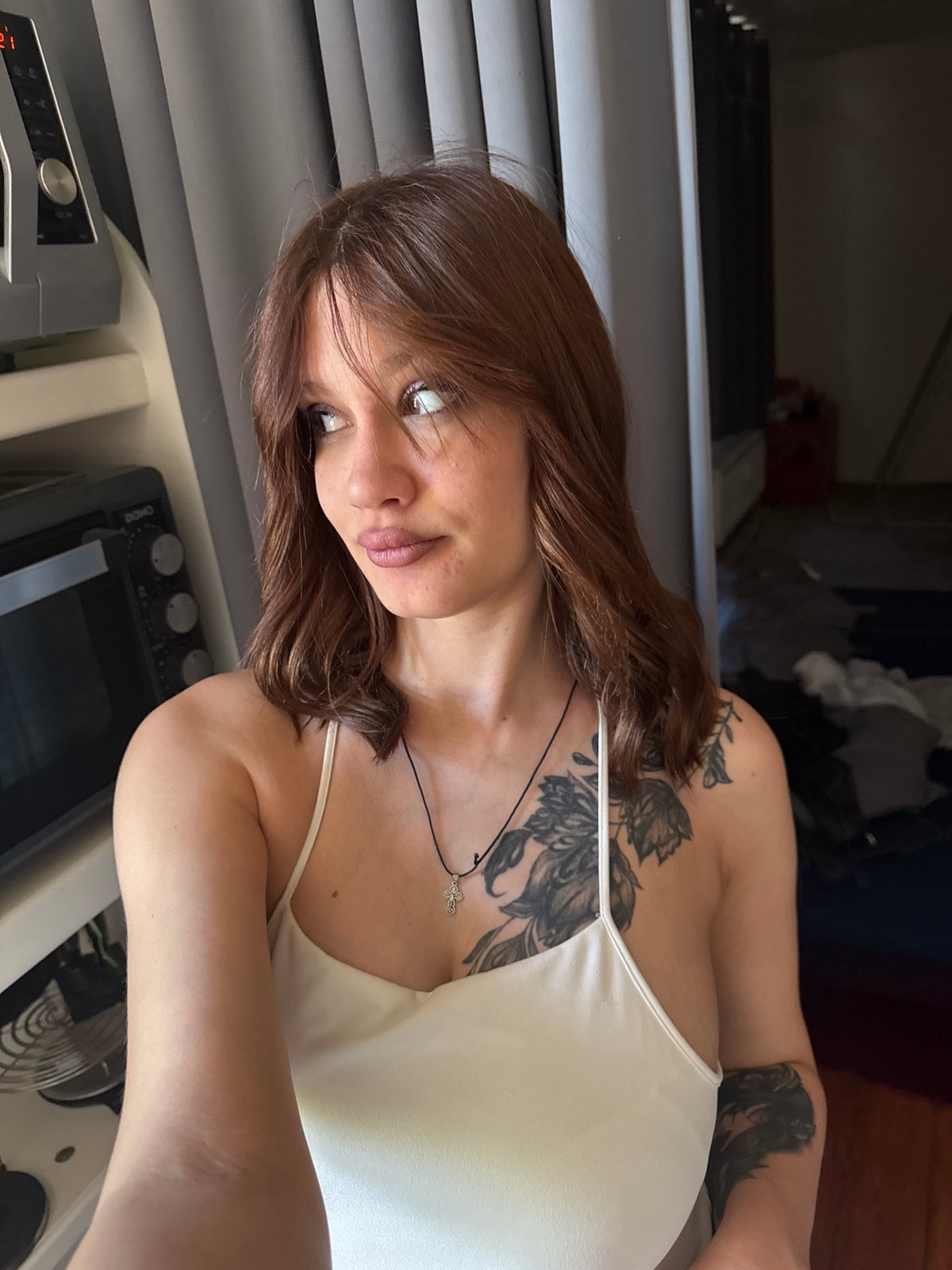 Woman takes rotated selfie indoors in Antwerp, Belgium