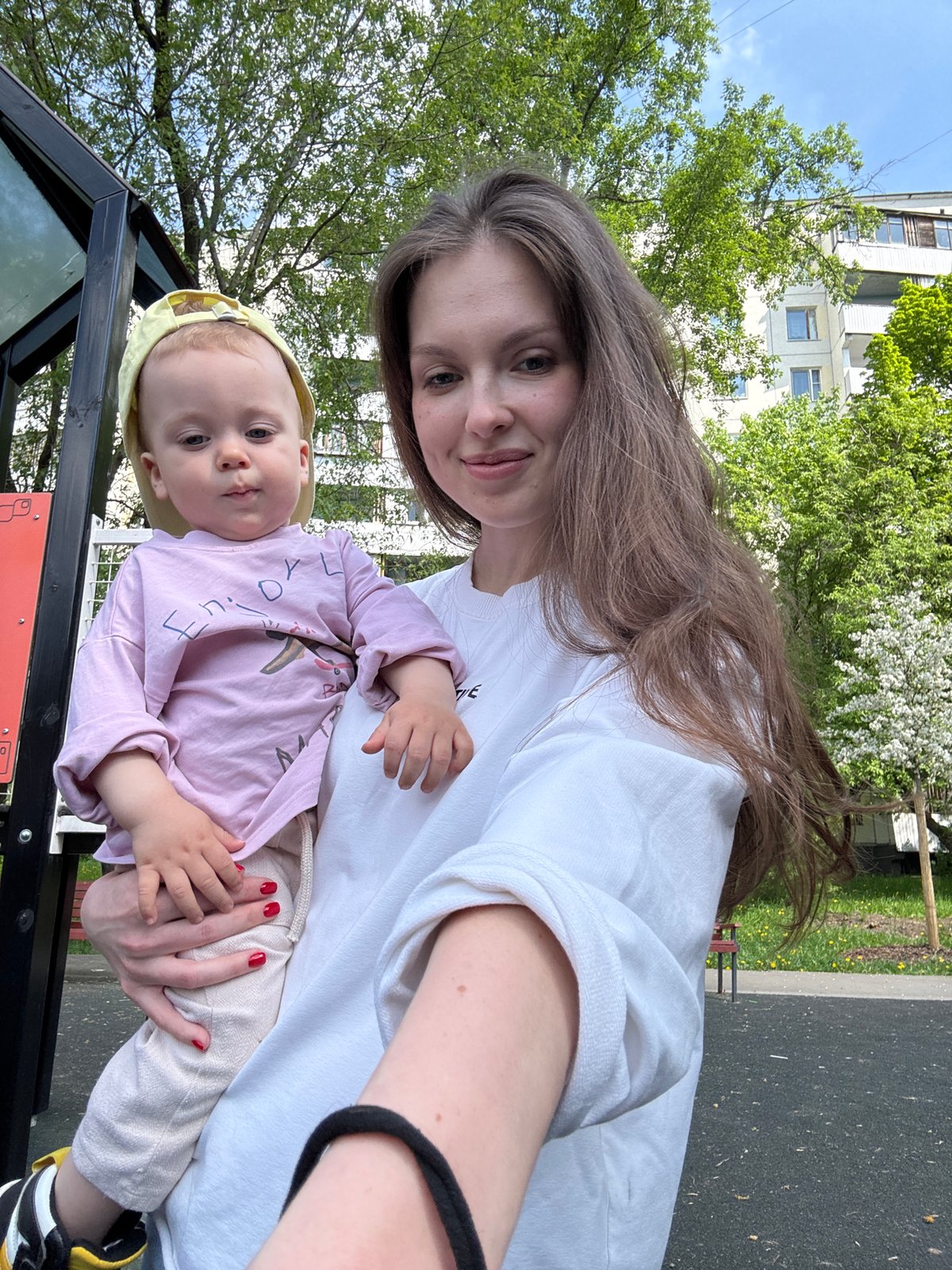 Mother and toddler enjoy morning playground visit in Moscow