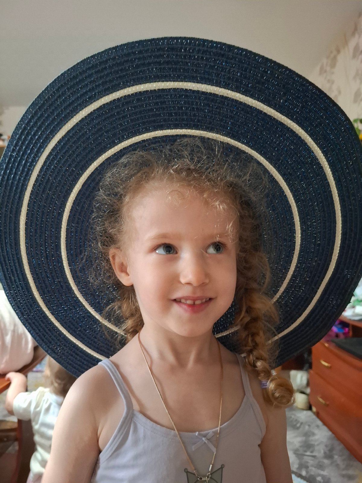 Portrait of blonde girl in navy hat captured in Russia