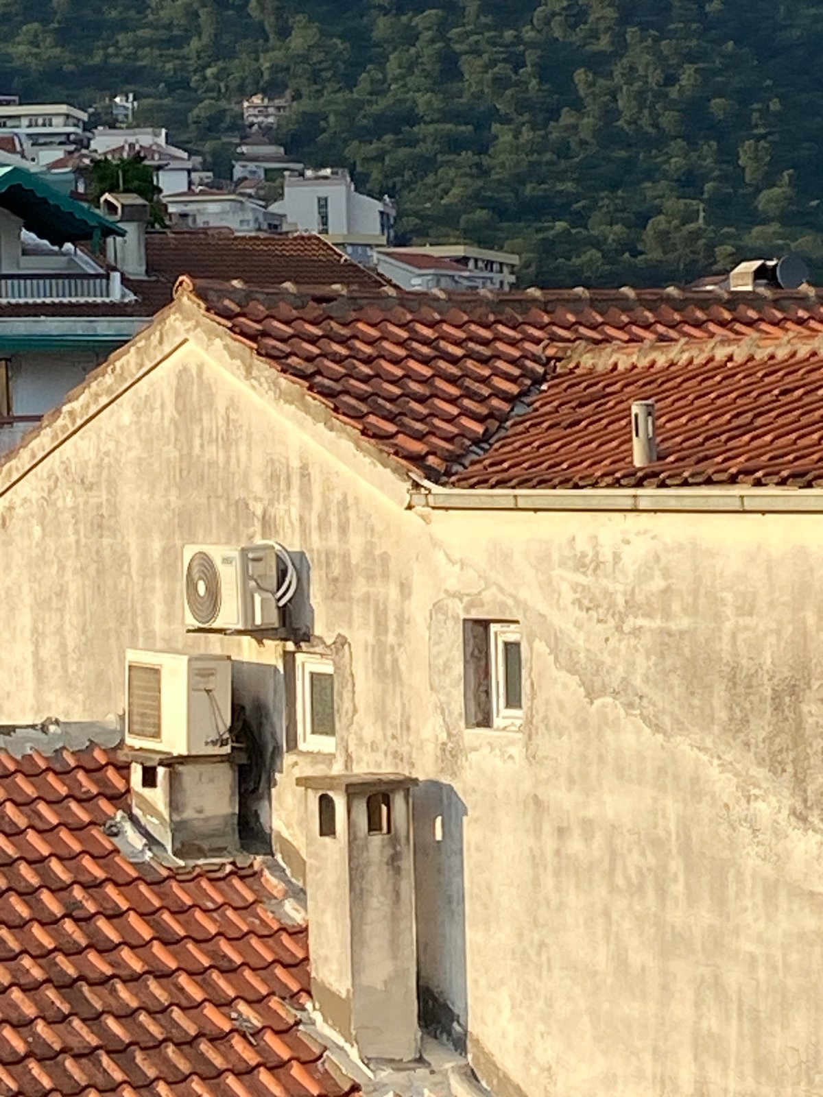 Aerial documentation of Budva cityscape during golden hour