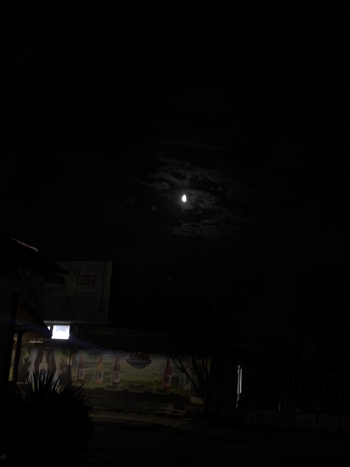 Full moon photographed over Varna building with bottle mural
