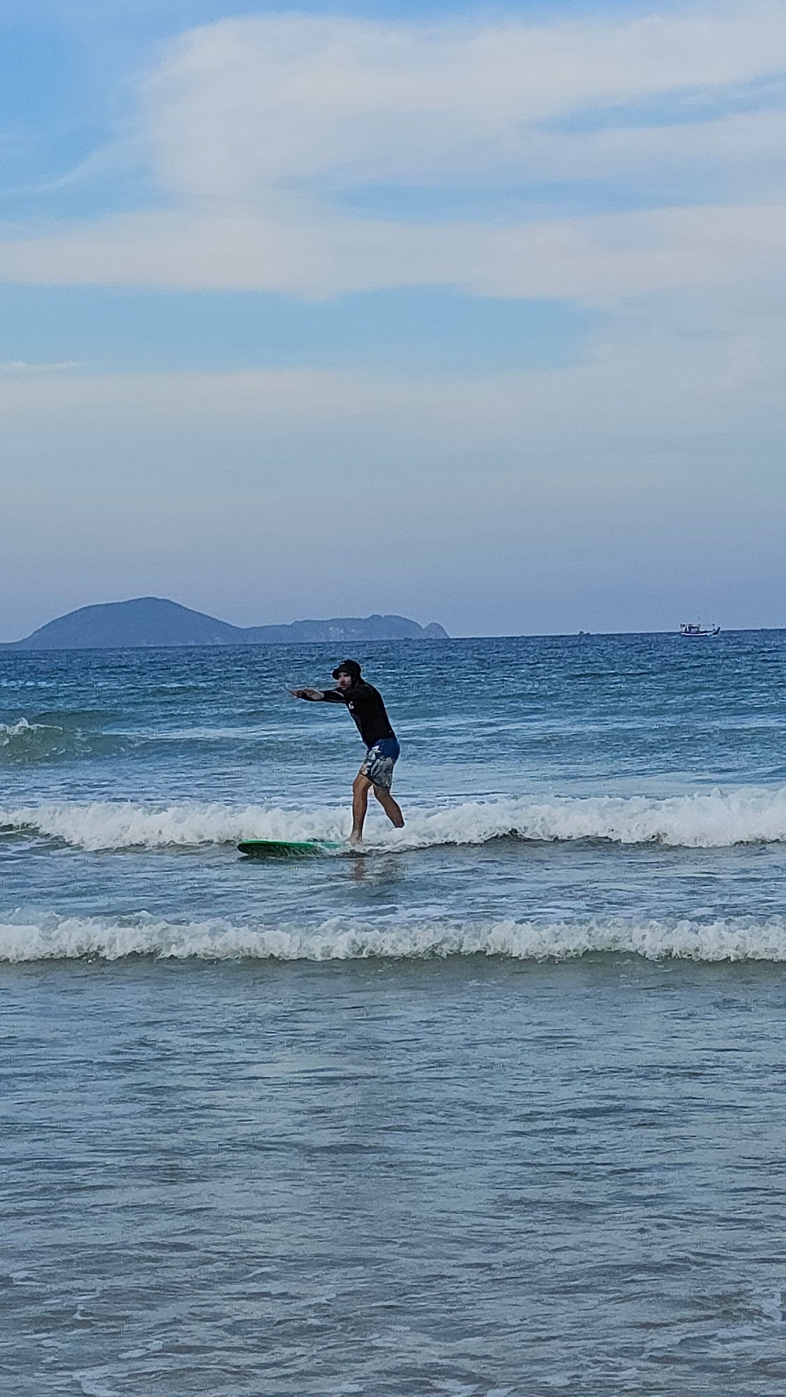 Surfer documents morning session at Bai Dai Beach, Vietnam