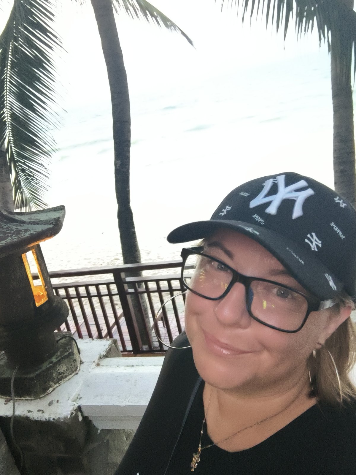Beach resort day in Phu Thuy Ward — pool, palms, and ocean
