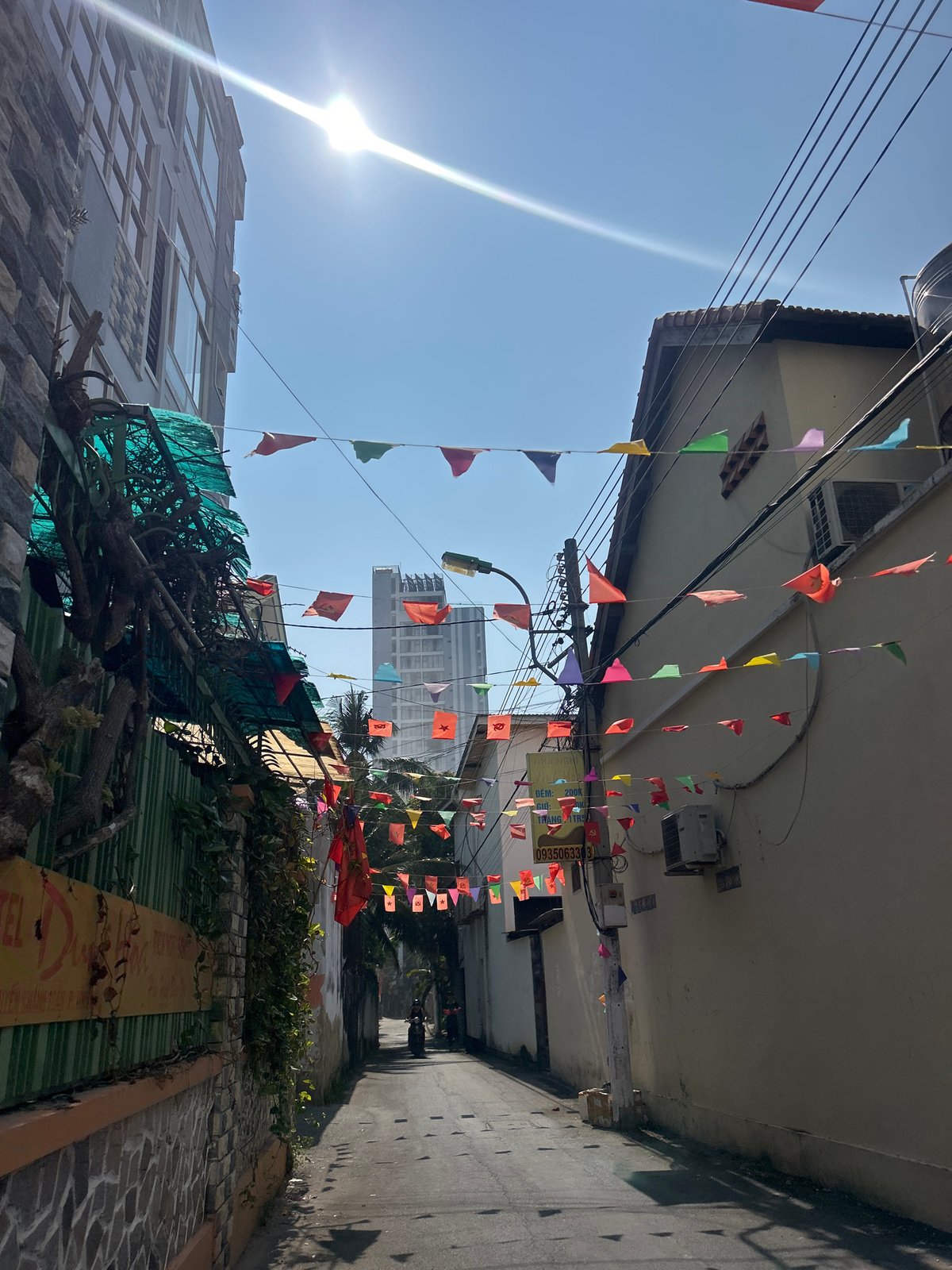 Street photography captures flags and architecture in Bắc Nha Trang