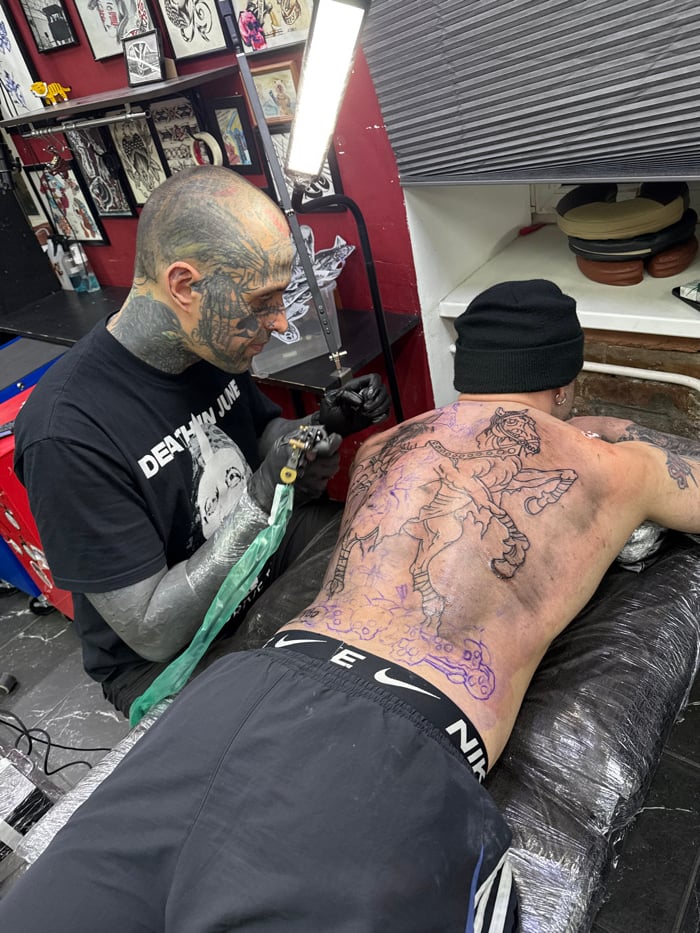 Tattoo session documented at Moscow studio Tuesday evening