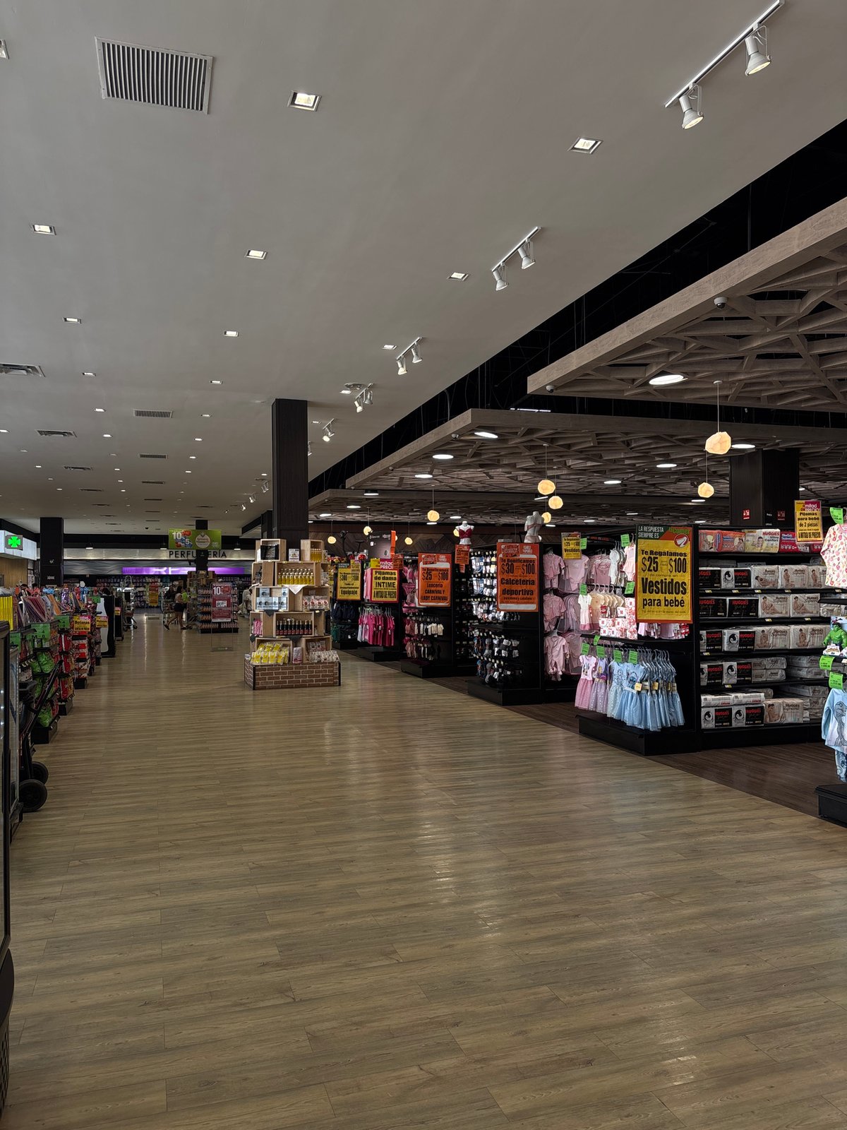 Shoppers document supermarket interiors in Puebla, Mexico
