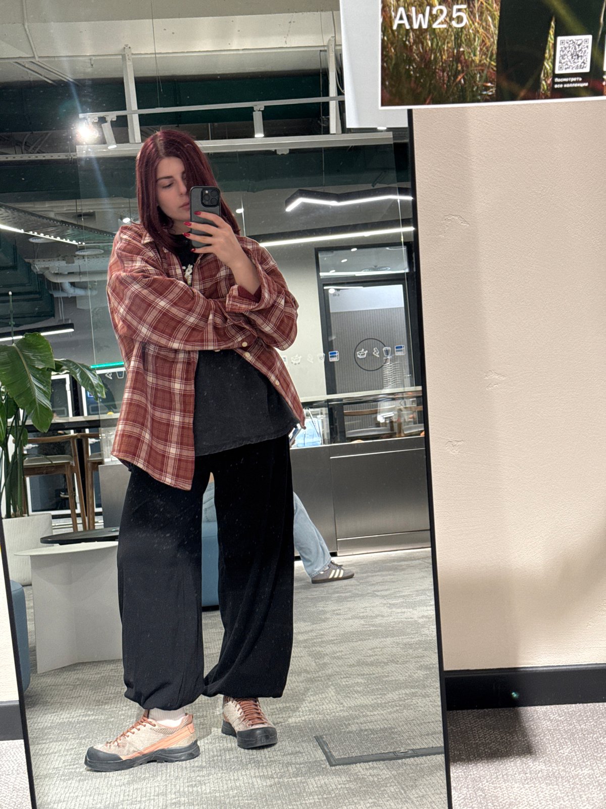 Woman takes office mirror selfie in Khimki