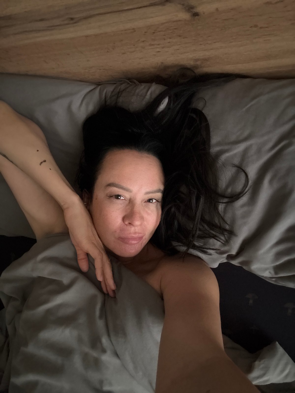 Woman rests, reads in bedroom in Chaikovsky, Russia