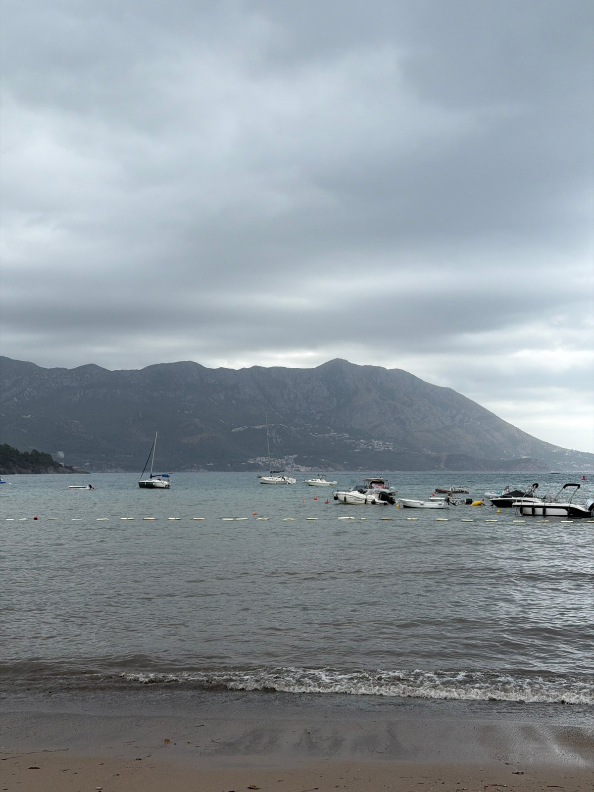 Cloudy morning at Budva's waterfront Ferris wheel