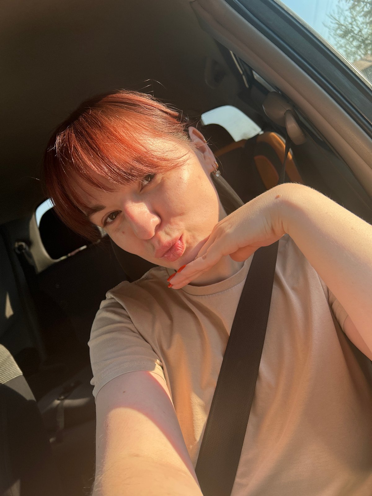 Red-haired person photographed inside car in Фоки, Russia