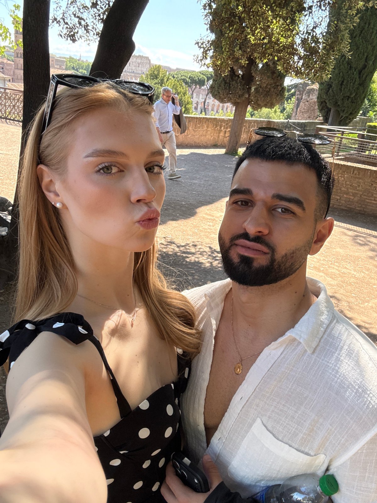 Couple tours Roman Forum and gardens during morning visit
