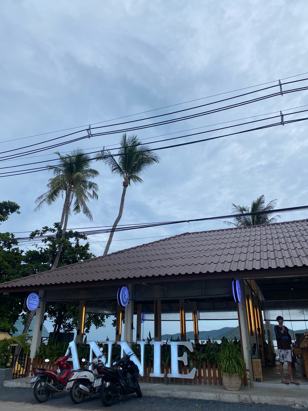Tourist documents quiet coastal moments in Thai fishing village