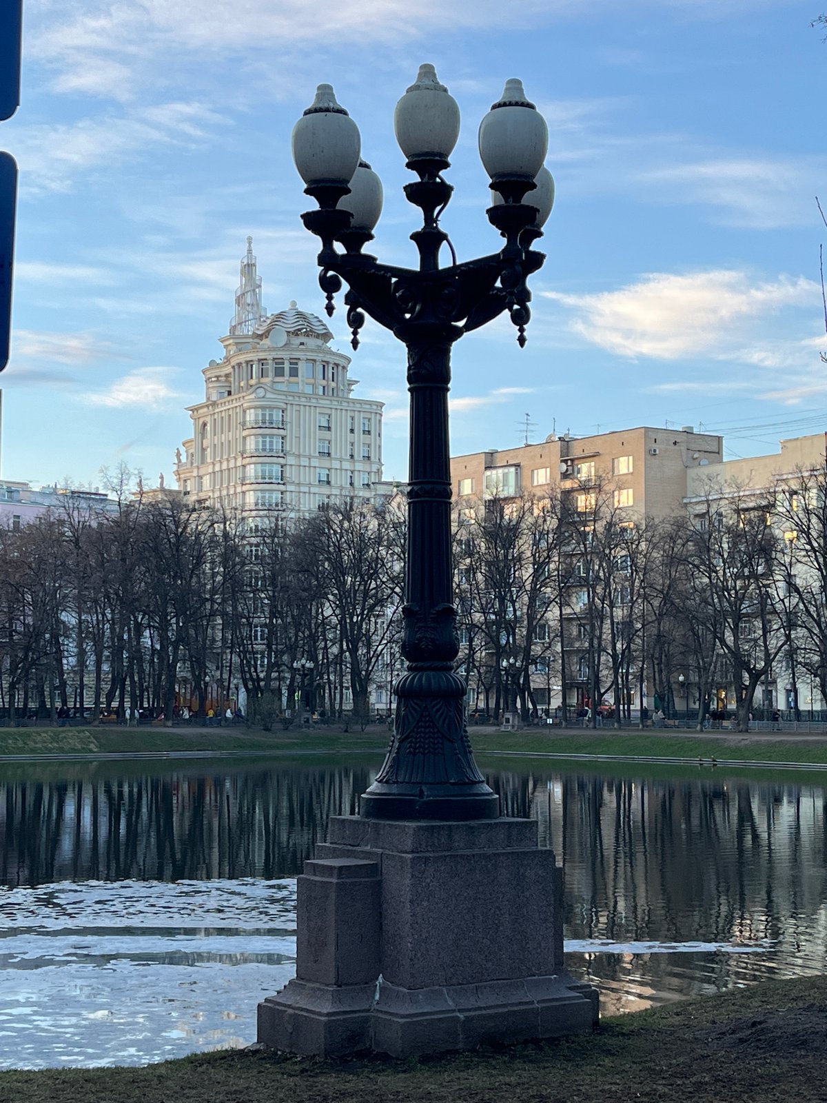 Moscow street scene shows ornate lamppost near water