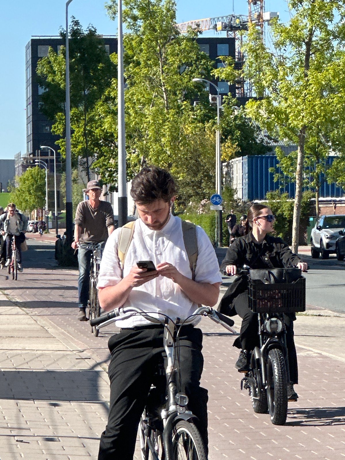 Amsterdam residents document ordinary Friday afternoon urban life