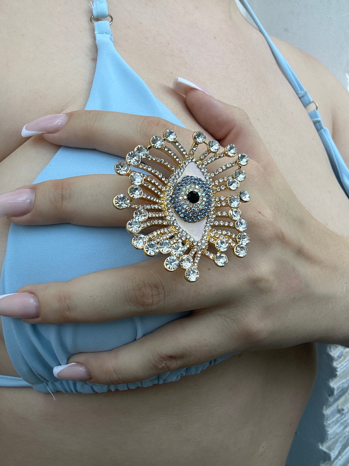 Evil eye ring detail shots with a tabby cat, Odesa