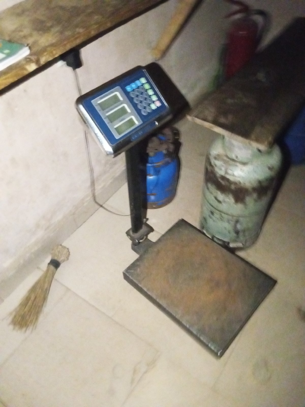 Inside a cramped storage room stocked with gas and supplies
