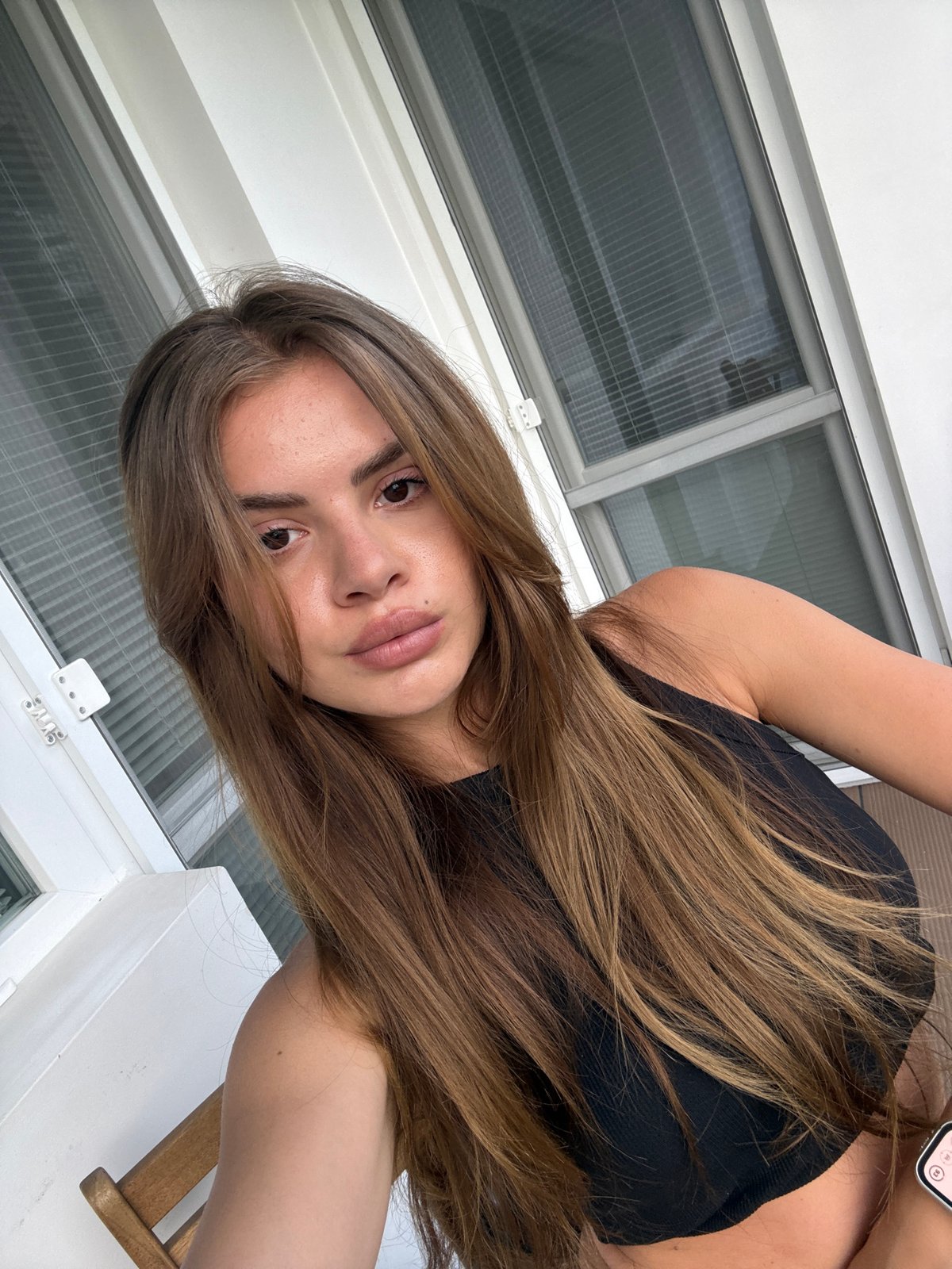 Woman documents casual photo session in selfies and videos