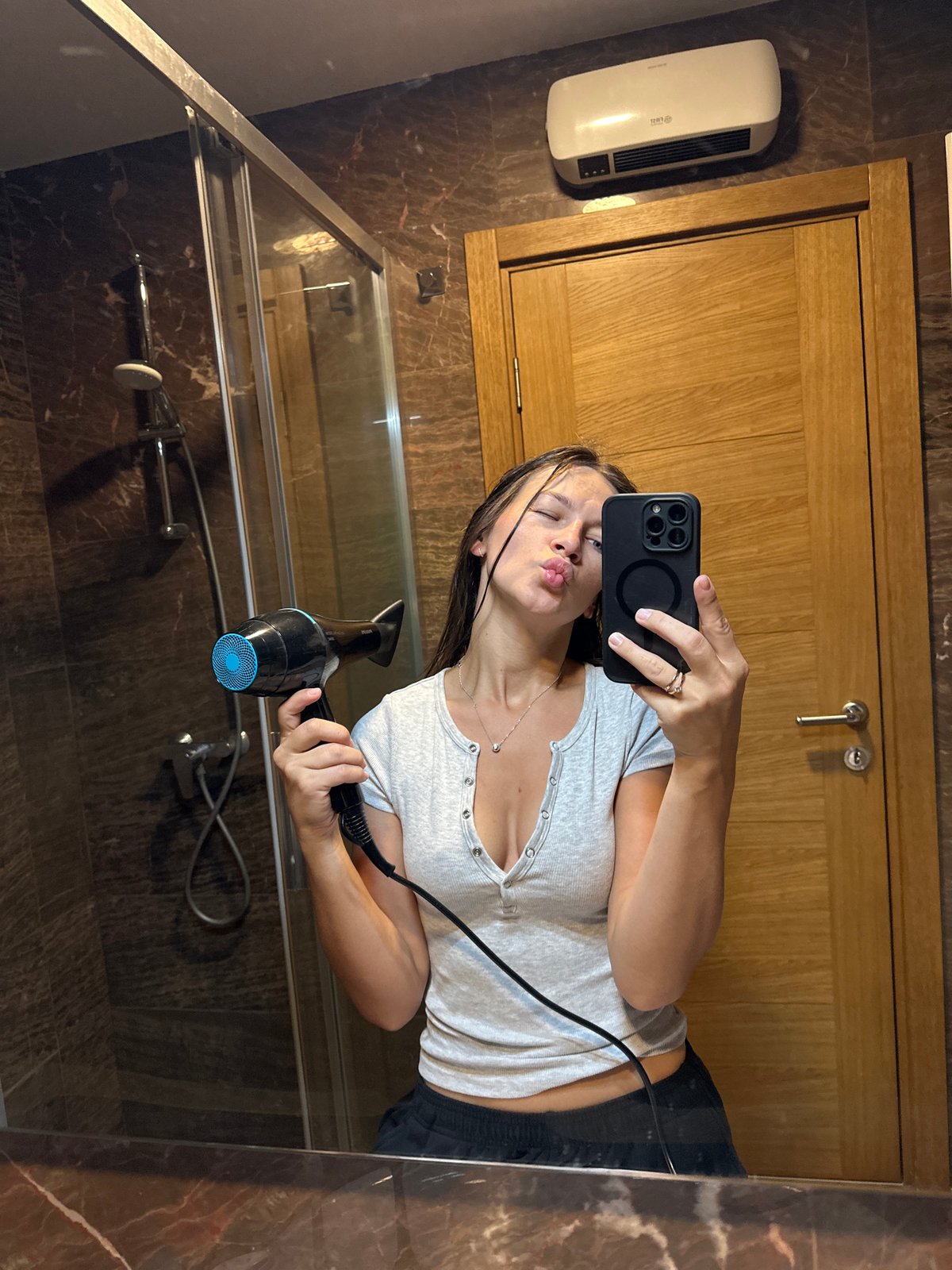 Mirror selfie mid-routine, hairdryer in hand, Donji Pobori
