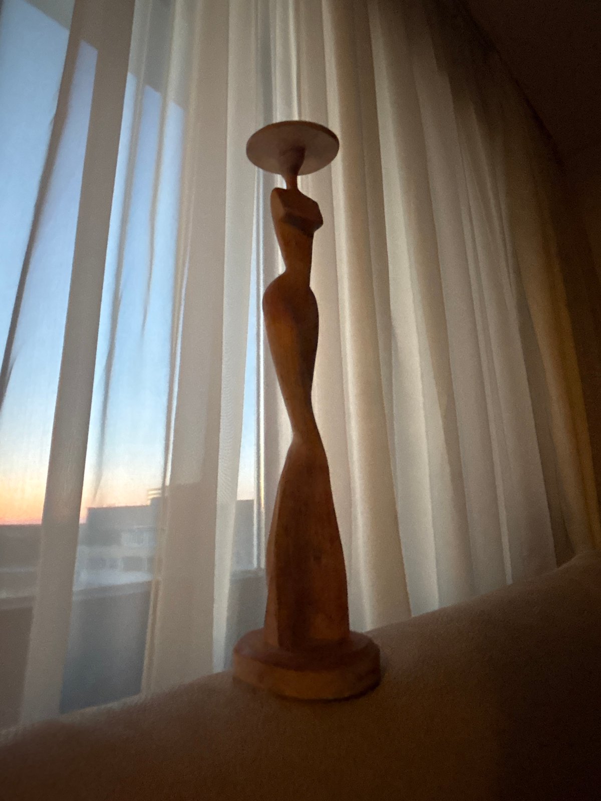 Minsk resident captures wooden sculpture and sunset scenes Friday evening