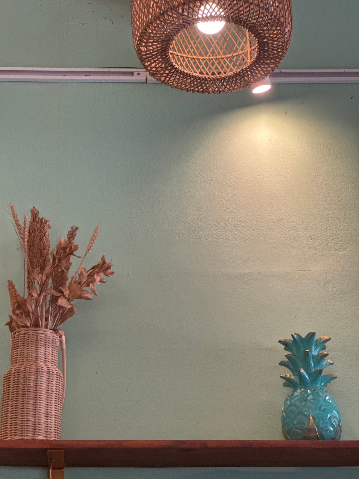 Quiet afternoon inside a green-walled café in Kuta Selatan