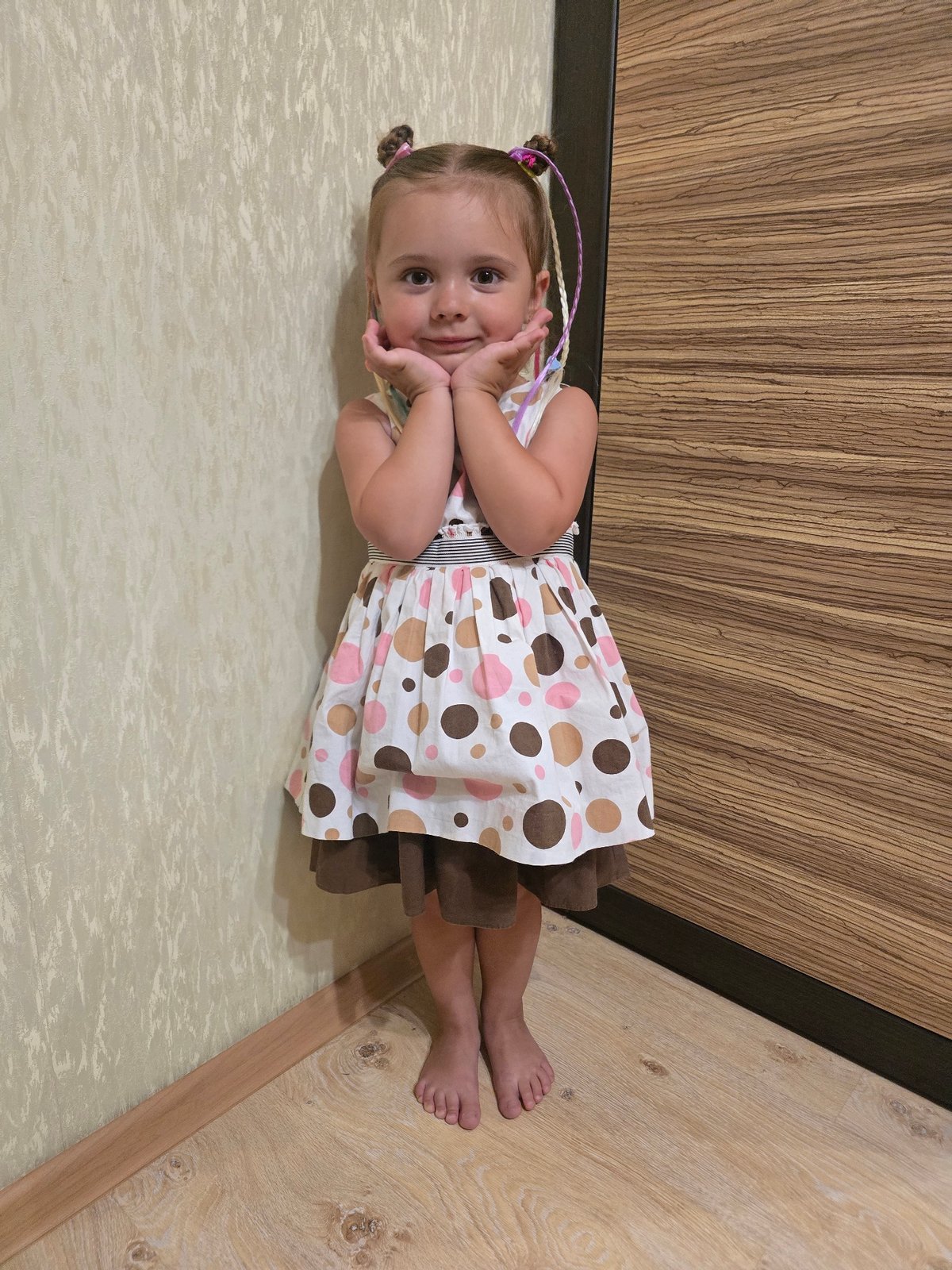 Two poses, same room, same patterned white dress.