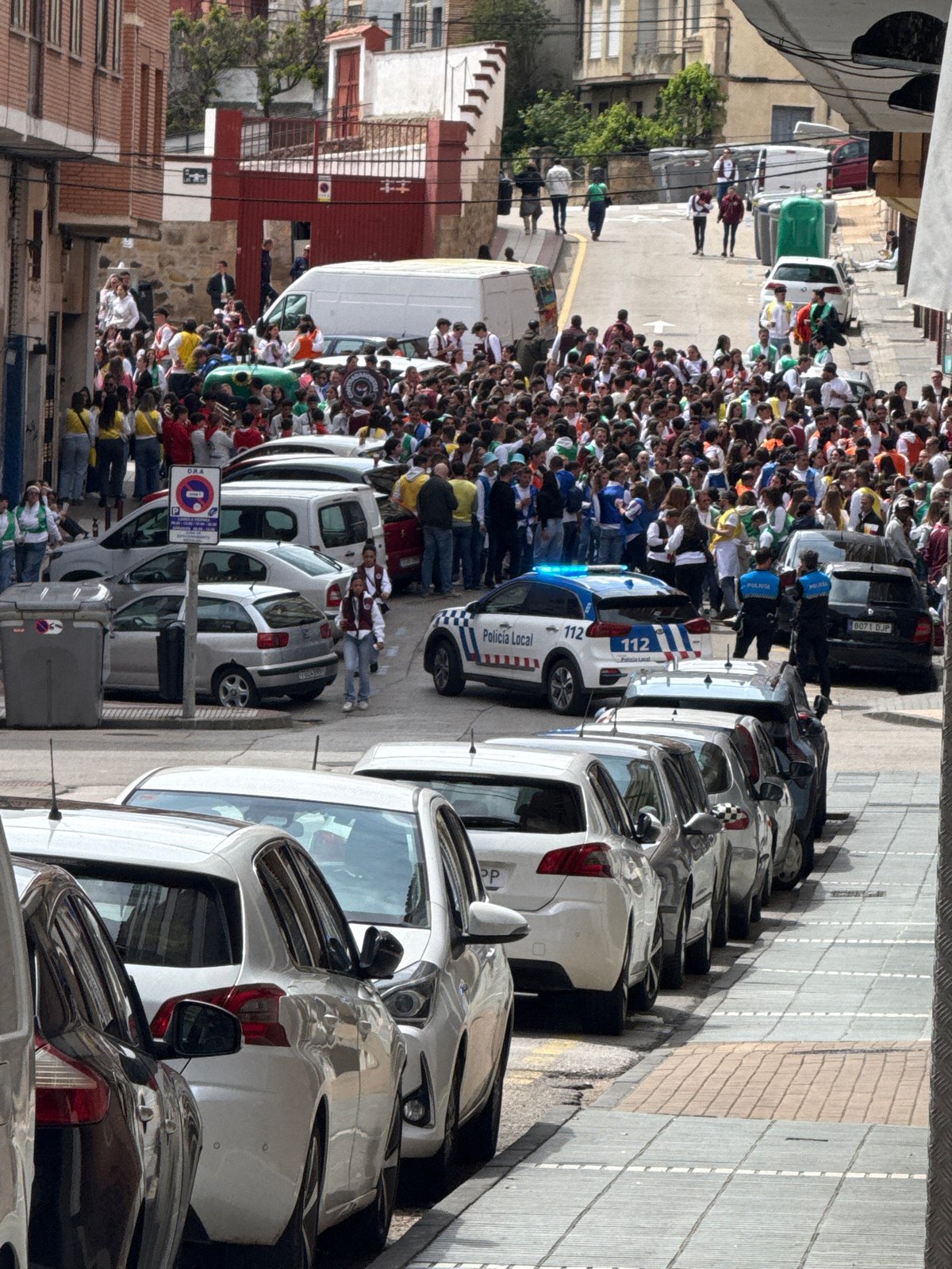 Festive crowd gathers on street in Soria, Spain