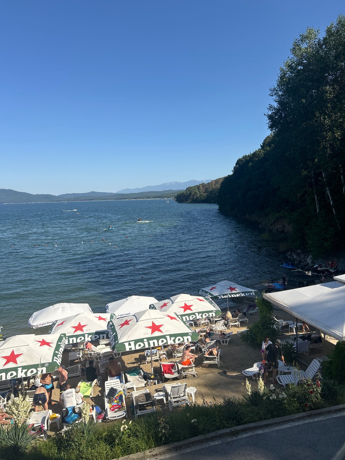 Sunny afternoon at a Heineken-sponsored lakeside beach club, Bulgaria