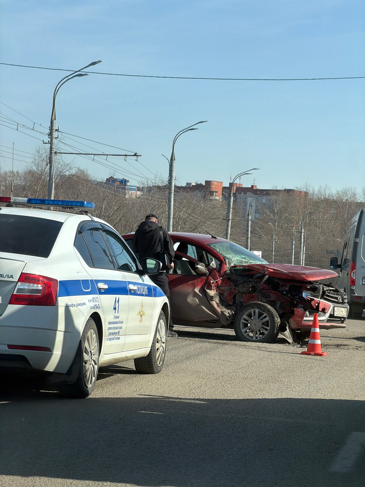 Traffic accident leaves red car heavily damaged in Izhevsk