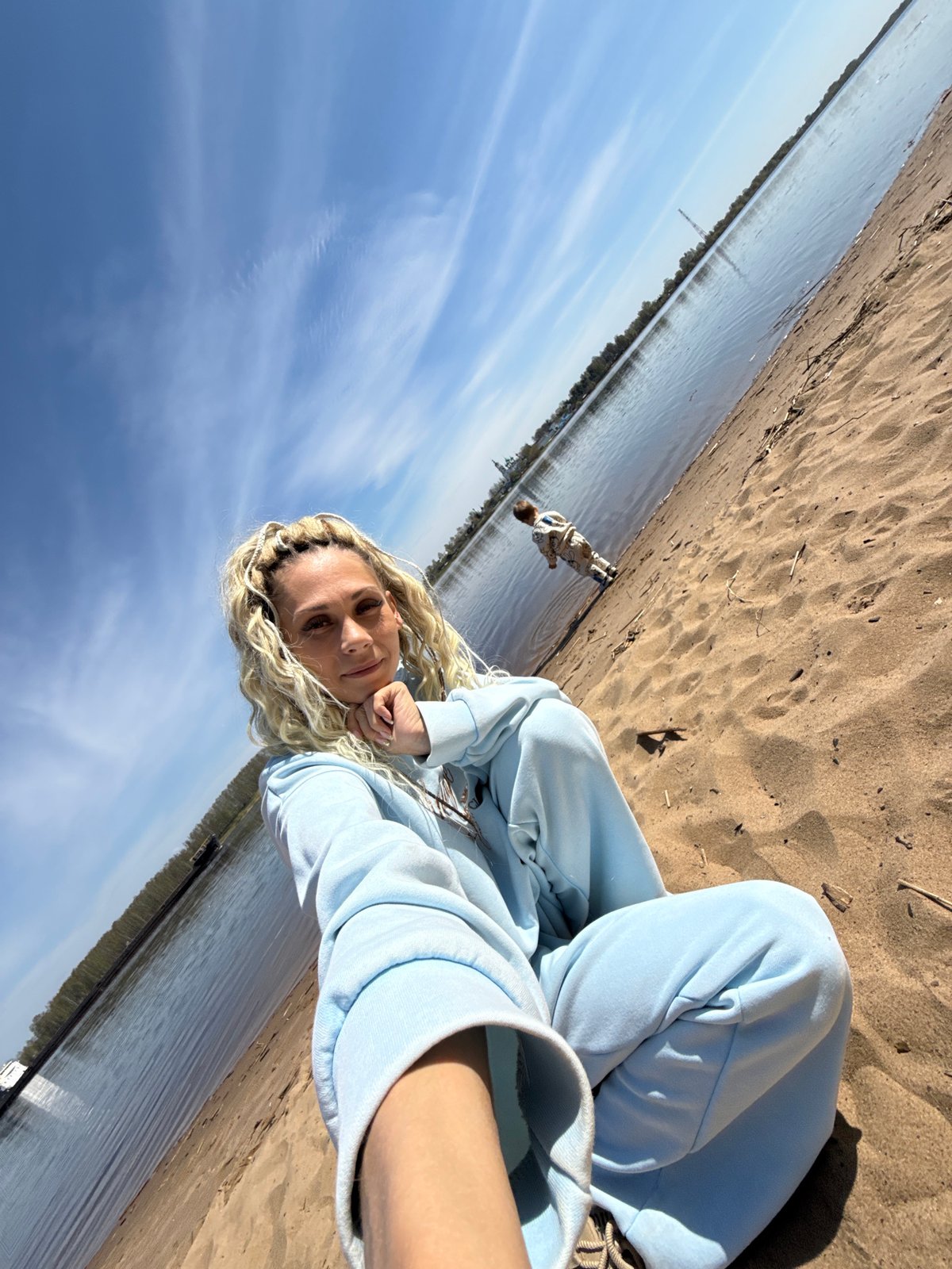 Woman in tracksuit photographed on beach in Rusanovo, Russia