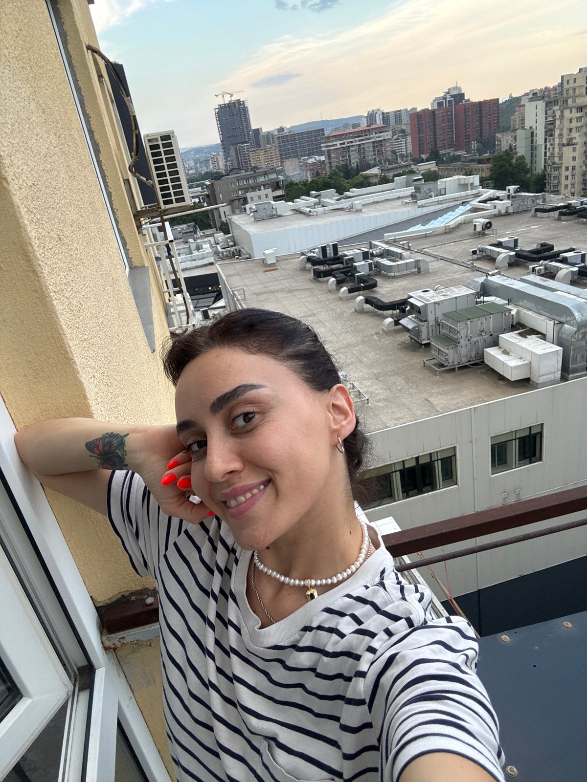 Afternoon in Tbilisi: balcony views, city skyline, and a cat