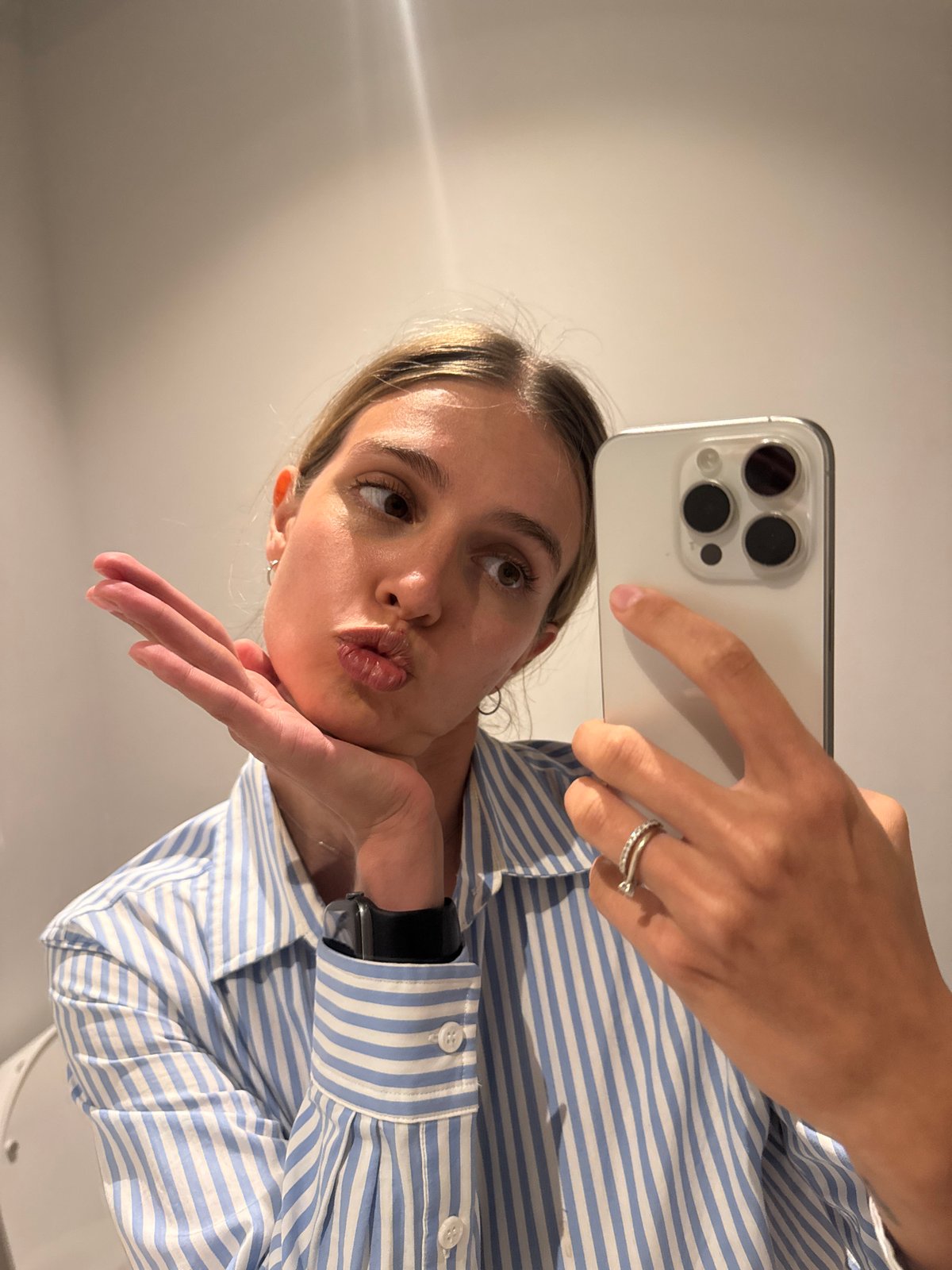Woman takes mirror selfies in Tbilisi apartment