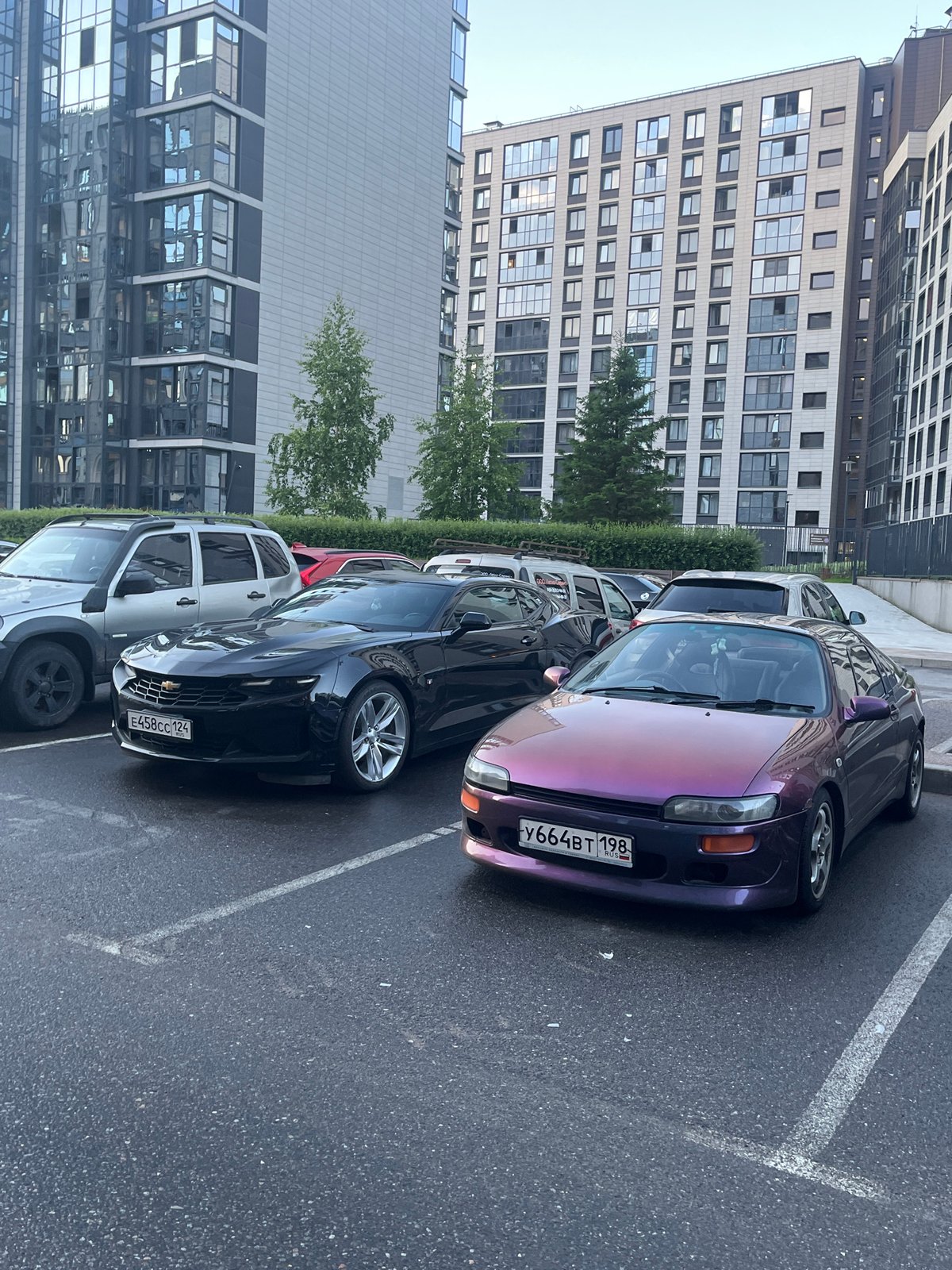 Cars parked outside modern buildings in Russia