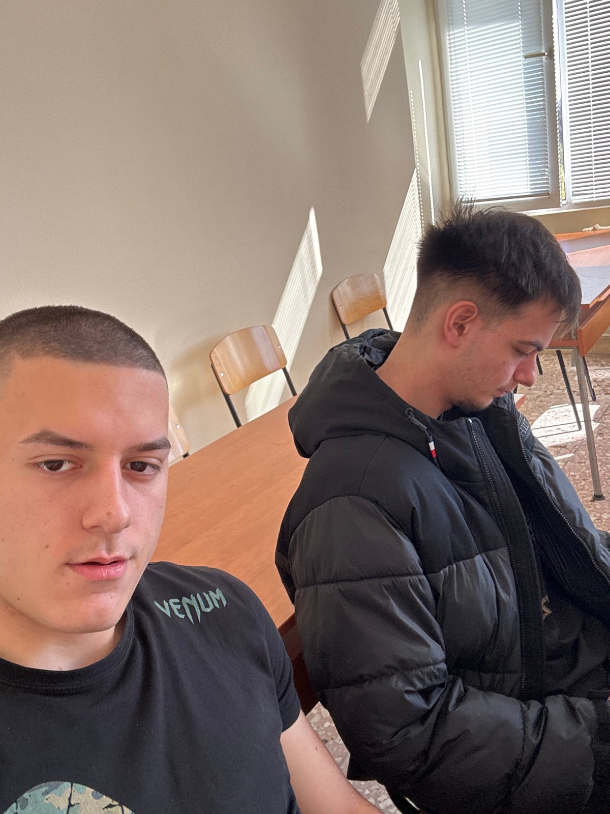 Two young men photographed indoors in Plovdiv, Bulgaria