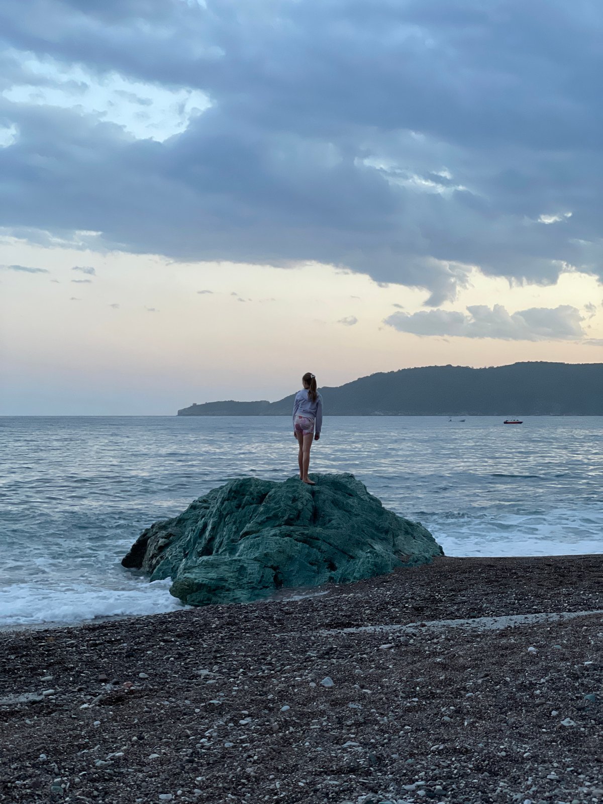Evening beach gathering captured in Rafailovići, Montenegro
