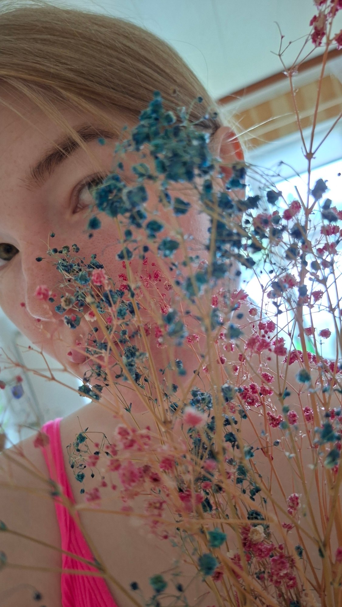 Early morning photo session captures woman among spring flowers