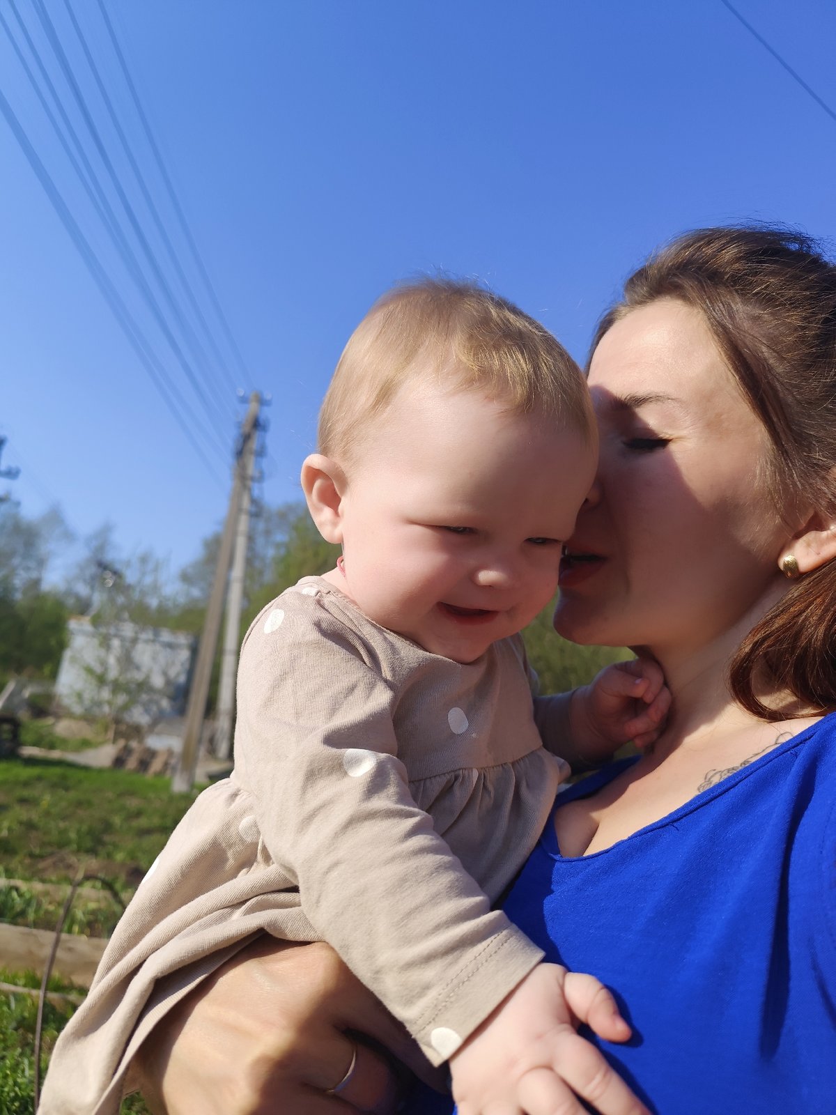 Woman grills meat while caring for baby in Russian woods