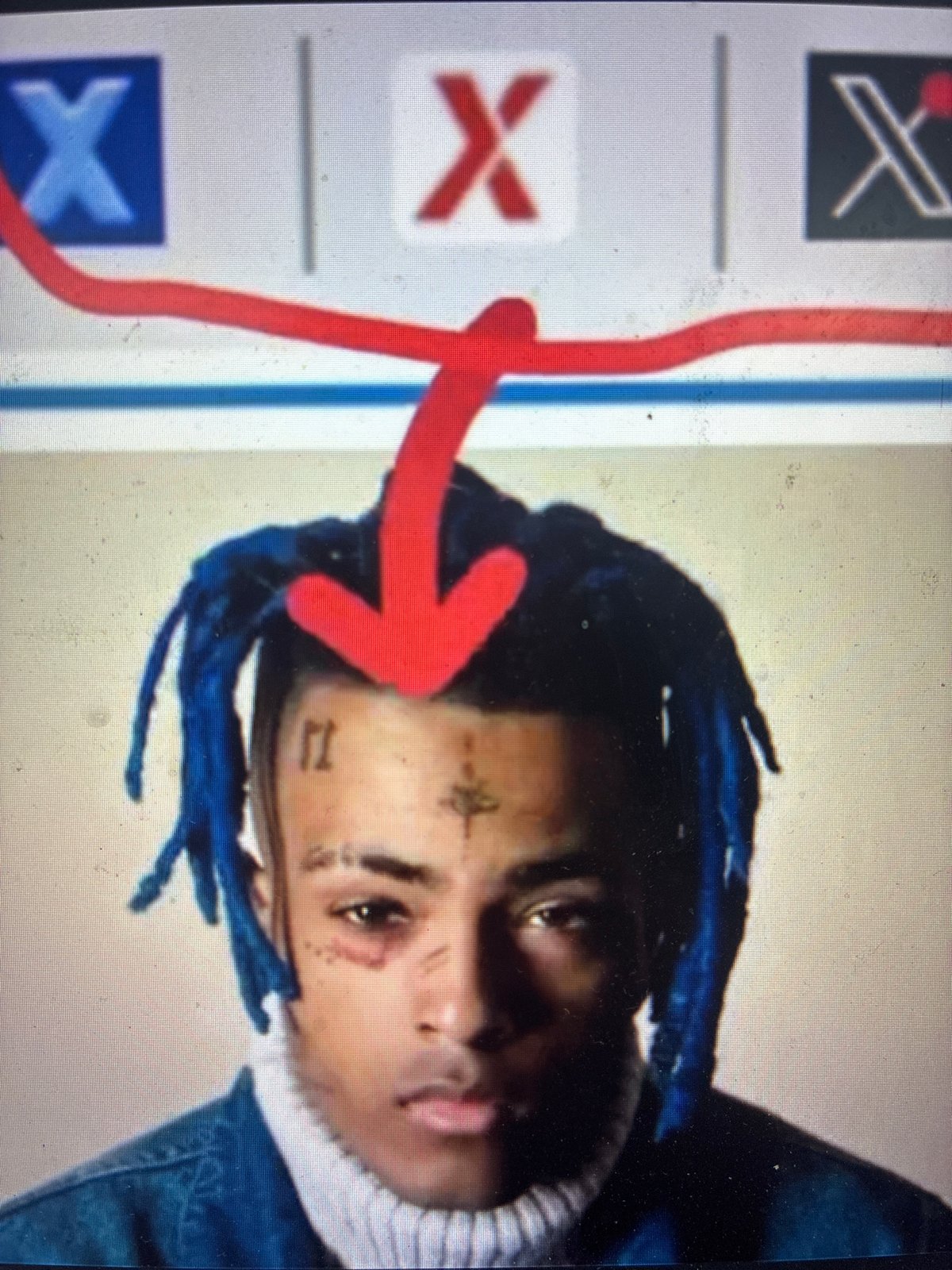 Screen displays person with blue dreadlocks, facial tattoos in Mexico