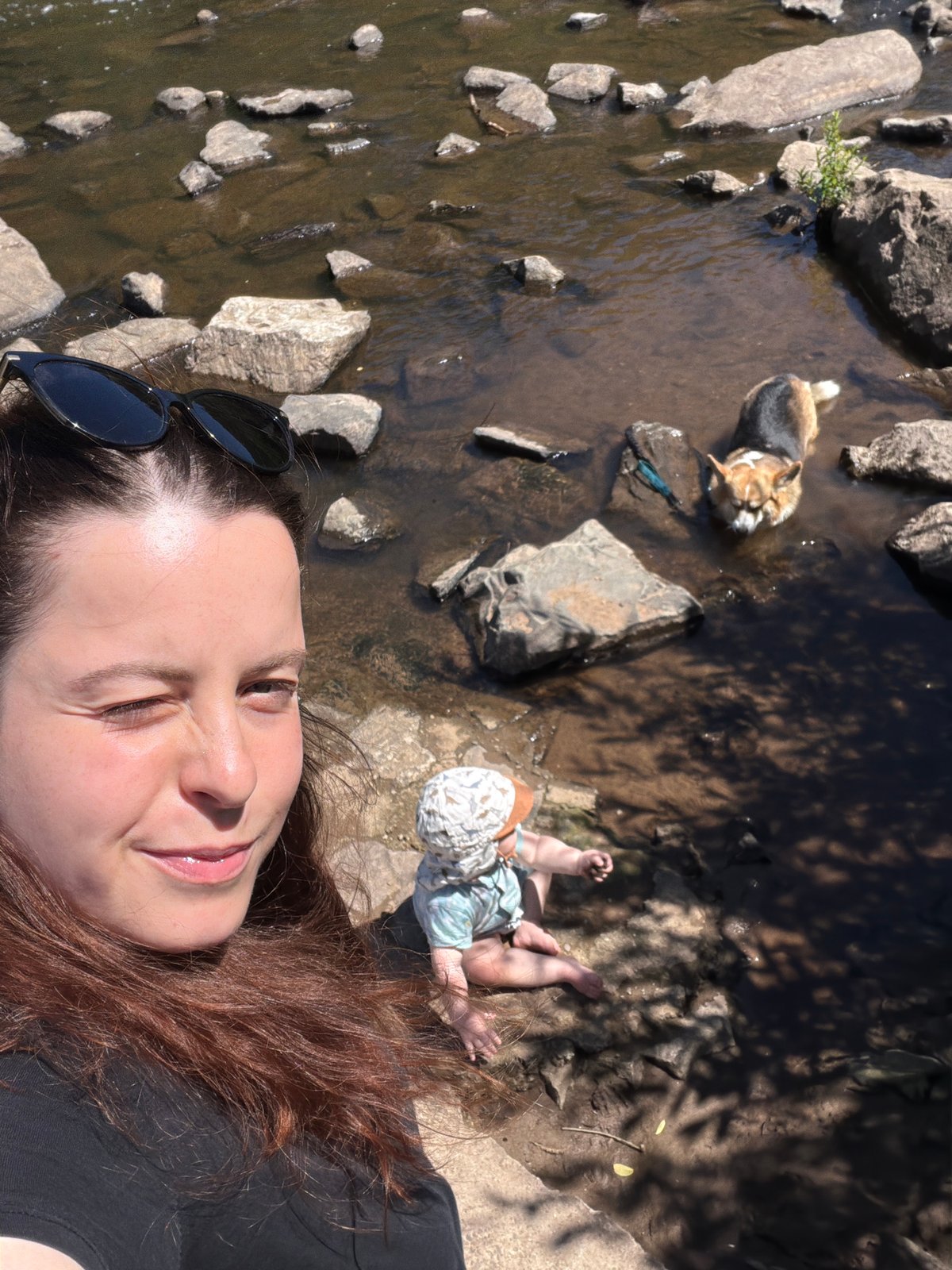 Riverside family time with baby and corgi in Meisenheim