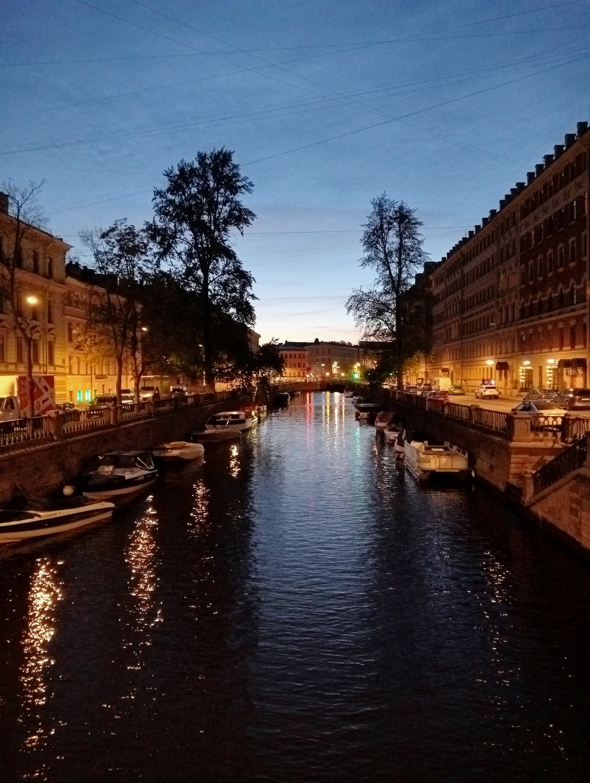 Evening canal life captured across Saint Petersburg during white nights
