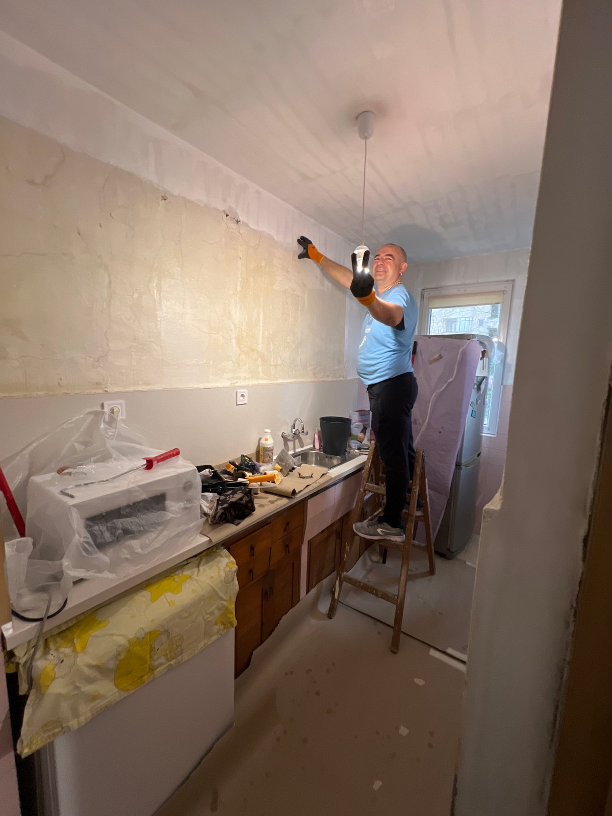 Worker performs renovation tasks in Varna building
