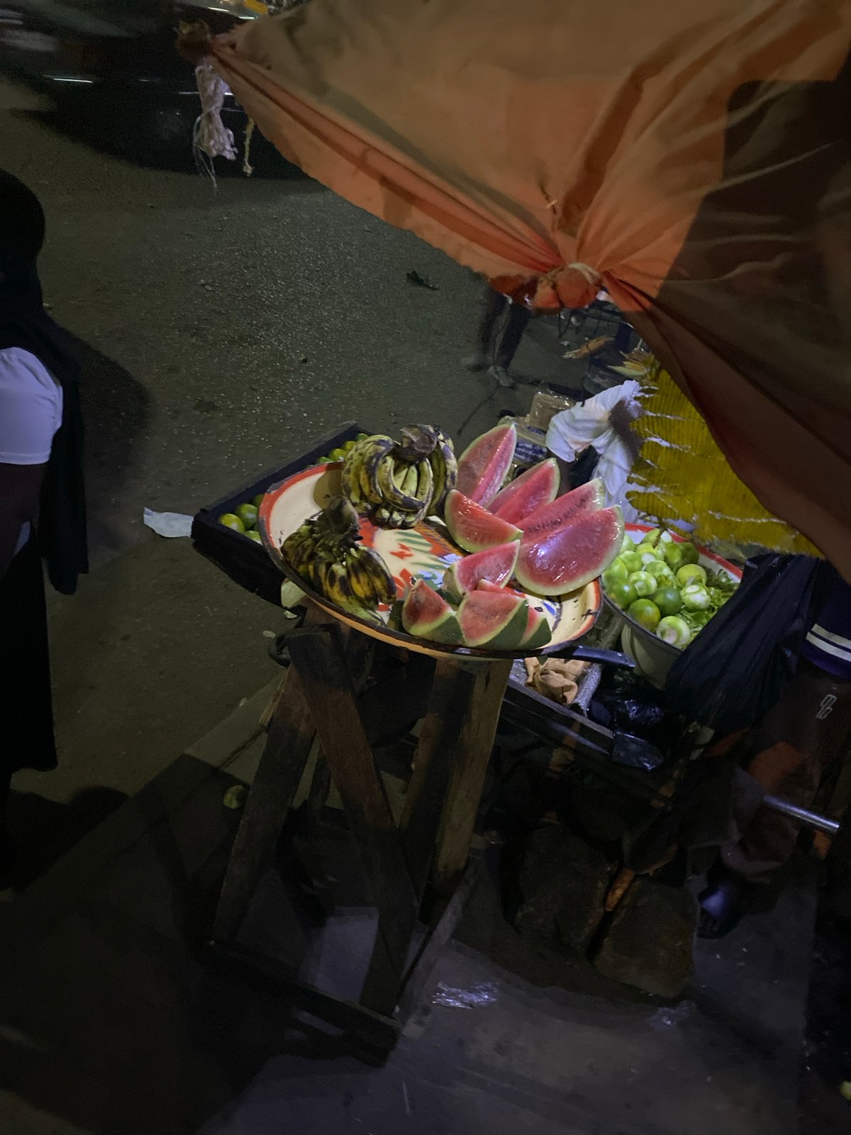 Night market vendors serve grilled meat in Bukuru Nigeria