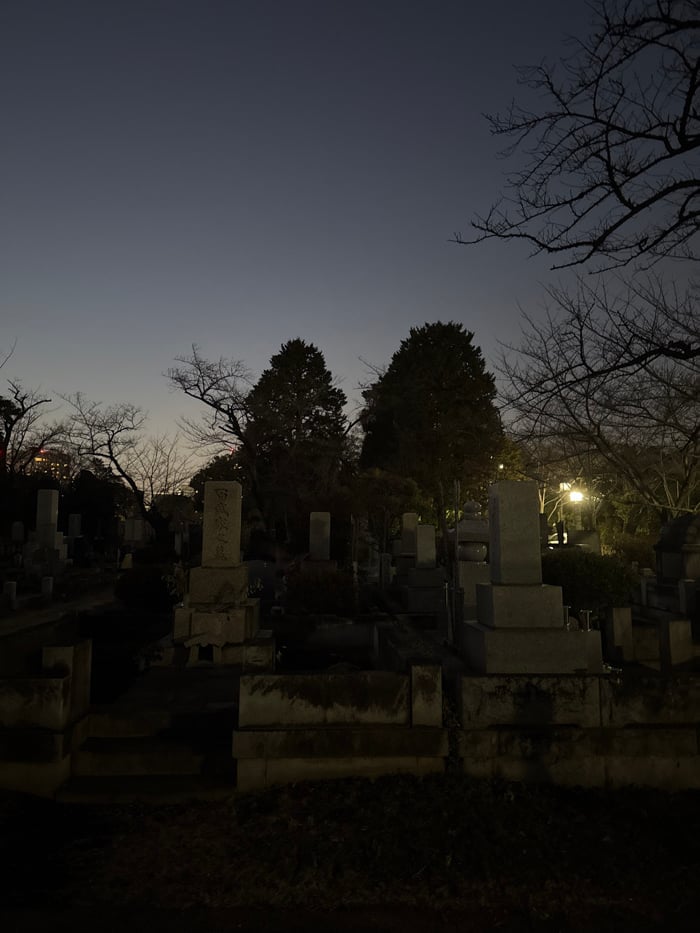 Cemetery scene documented in Minato during evening hours
