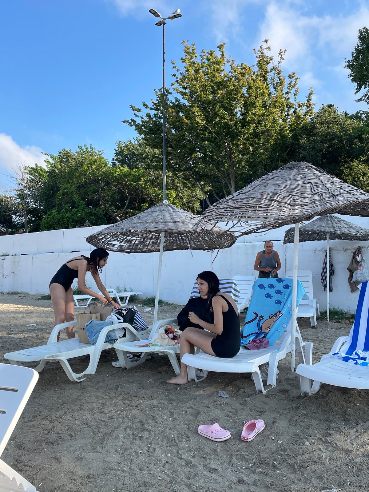 Summer morning at Moda Beach, Kadıköy — swimmers and shoreline scenes